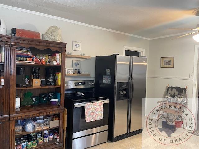 kitchen with ceiling fan, crown molding, and stainless steel appliances