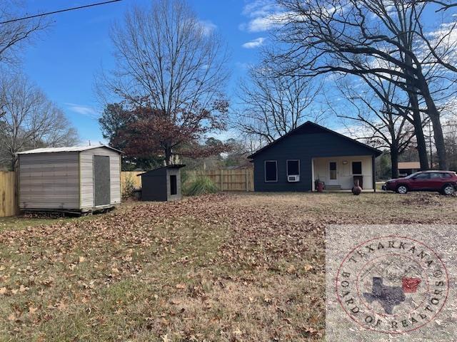 view of yard with a storage unit