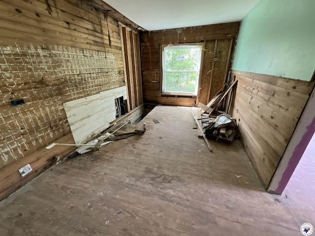 miscellaneous room with wood walls