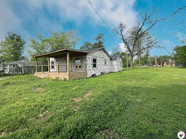 back of property with a yard