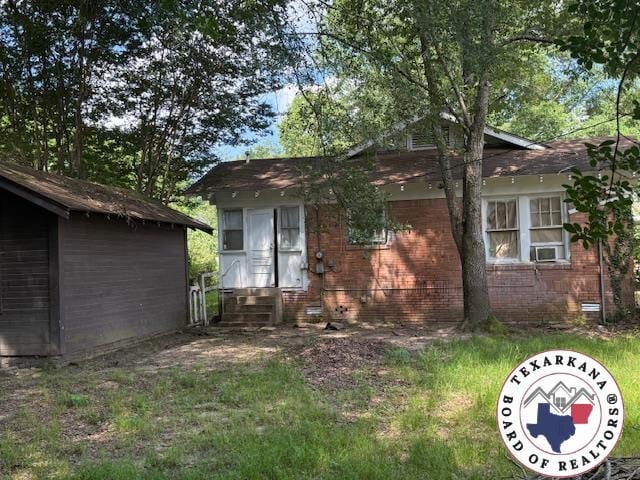 2308 Laurel St, Texarkana, AR 71854 - view of front of property with crawl space, cooling unit, brick siding, and entry steps