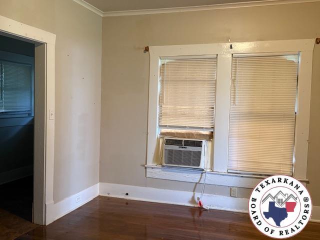 2308 Laurel St, Texarkana, AR 71854 - empty room featuring crown molding and wood finished floors