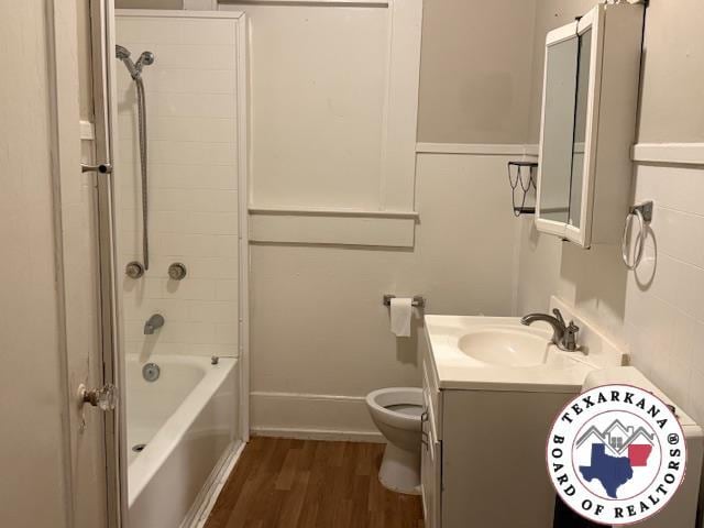 2308 Laurel St, Texarkana, AR 71854 - bathroom featuring vanity, wood finished floors, and shower / tub combination