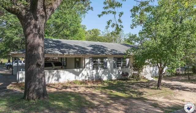928 Garland Ave, Texarkana, AR 71854 - view of front of house with roof with shingles and stucco siding