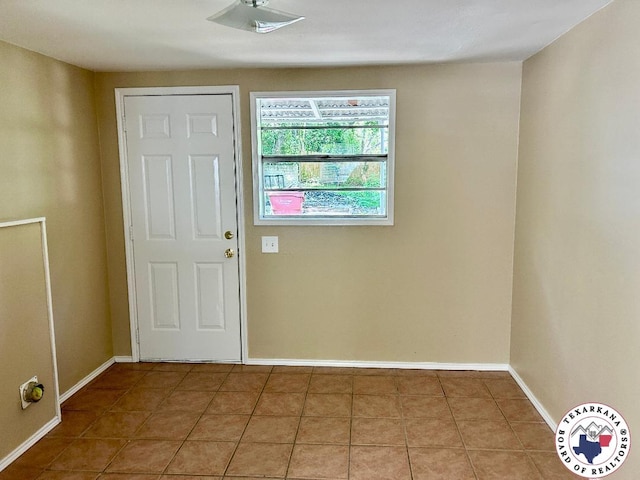 704 Florence St, Atlanta, TX 75551 - foyer entrance featuring baseboards and tile patterned flooring