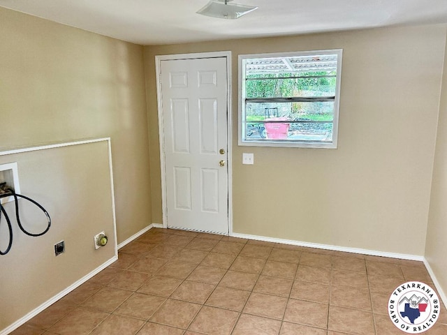 704 Florence St, Atlanta, TX 75551 - foyer with light tile patterned floors and baseboards