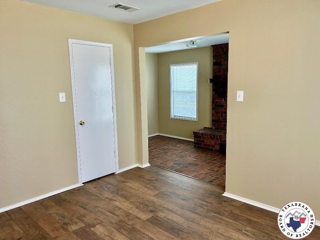 704 Florence St, Atlanta, TX 75551 - spare room featuring wood finished floors and baseboards