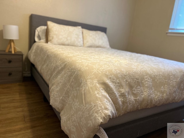 bedroom featuring dark hardwood / wood-style floors