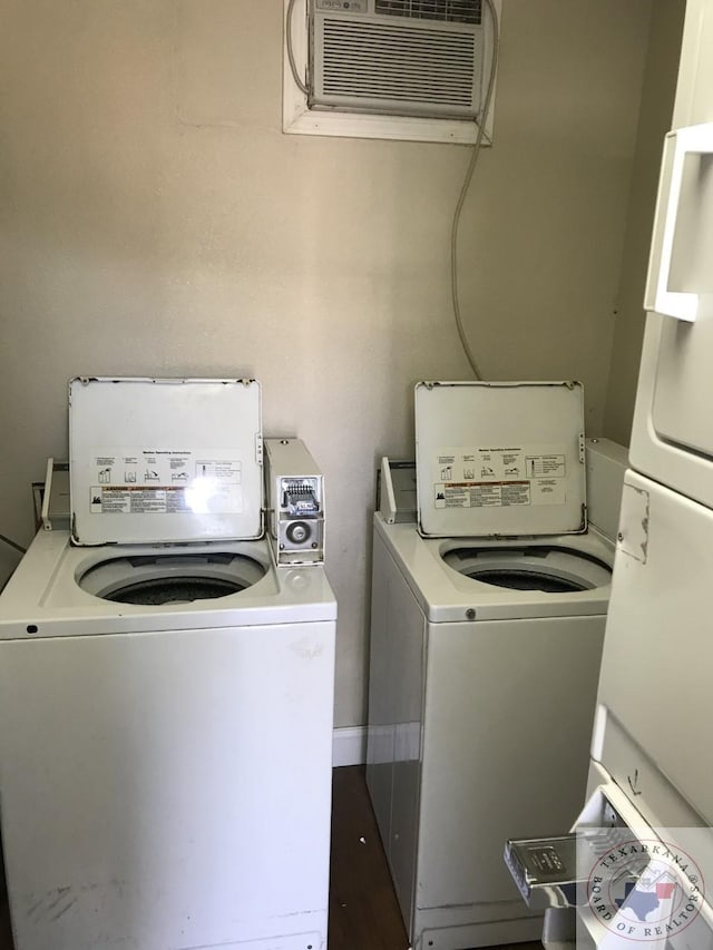 laundry area featuring separate washer and dryer and a wall unit AC