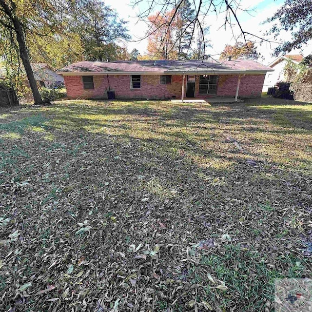 back of house with a yard