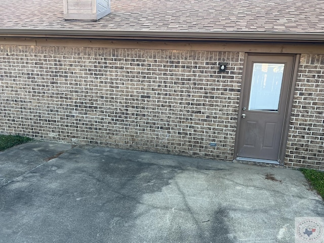 doorway to property with a patio