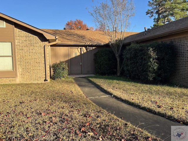 view of property exterior with a yard