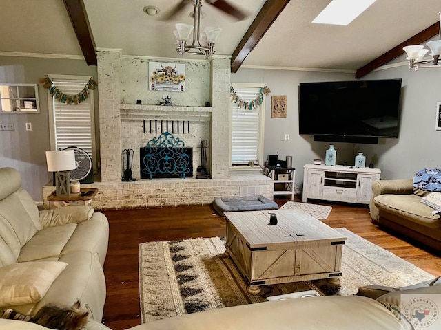 living room featuring a notable chandelier, hardwood / wood-style flooring, beamed ceiling, and a fireplace