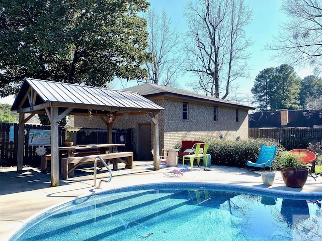 view of pool with a patio area and a gazebo