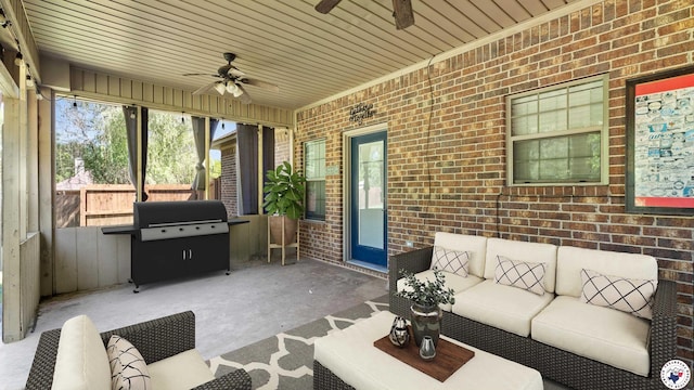sunroom / solarium featuring ceiling fan and an outdoor hangout area