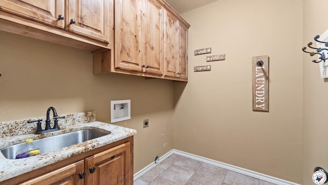 laundry room with a sink, cabinet space, electric dryer hookup, baseboards, and hookup for a washing machine