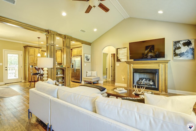 3428 Garrett Ln, Texarkana, TX 75503 - living room with ceiling fan, vaulted ceiling, light wood-style floors, a fireplace, and recessed lighting