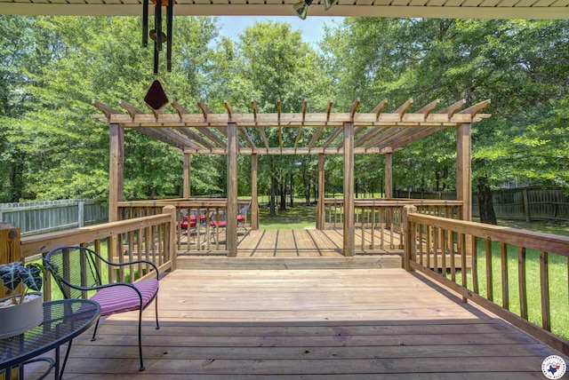 3428 Garrett Ln, Texarkana, TX 75503 - wooden deck with a pergola, a fenced backyard, and view of wooded area