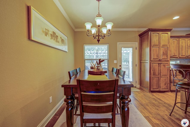 3428 Garrett Ln, Texarkana, TX 75503 - dining space with a chandelier, light wood-style floors, and ornamental molding
