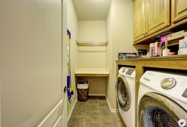 3428 Garrett Ln, Texarkana, TX 75503 - laundry room featuring independent washer and dryer, cabinet space, dark tile patterned flooring, and a textured ceiling