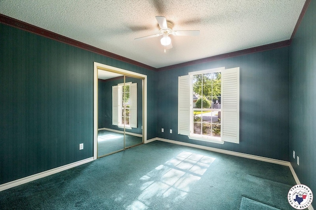 6102 Deerfield Dr, Texarkana, TX 75503 - unfurnished room featuring crown molding, ceiling fan, carpet, a textured ceiling, and baseboards