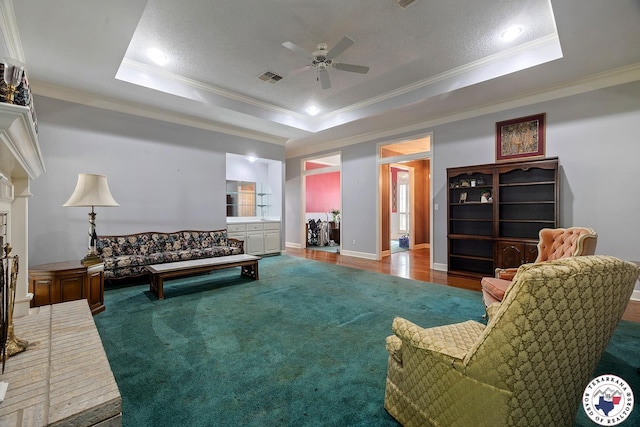 6102 Deerfield Dr, Texarkana, TX 75503 - living area featuring crown molding, a tray ceiling, a ceiling fan, baseboards, and recessed lighting