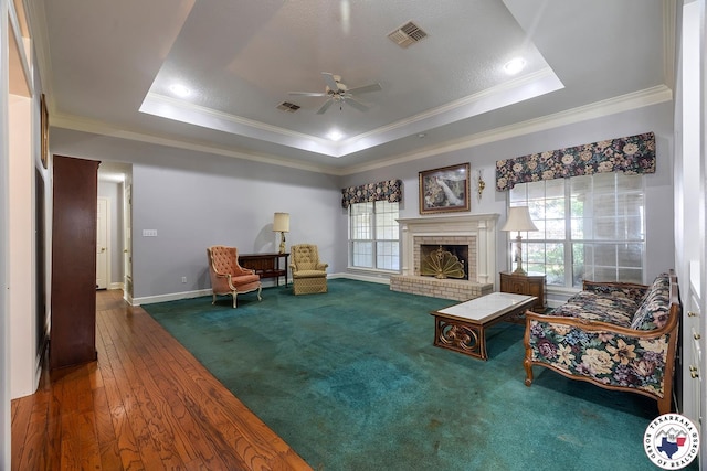 6102 Deerfield Dr, Texarkana, TX 75503 - living room featuring ornamental molding, a raised ceiling, a ceiling fan, healthy amount of natural light, and recessed lighting
