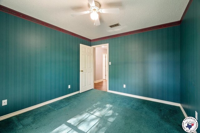 6102 Deerfield Dr, Texarkana, TX 75503 - unfurnished room with a textured ceiling, ornamental molding, a ceiling fan, carpet floors, and baseboards