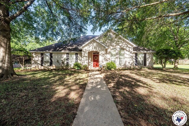 6102 Deerfield Dr, Texarkana, TX 75503 - ranch-style home featuring a front yard and brick siding