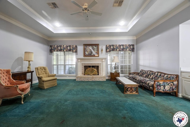 6102 Deerfield Dr, Texarkana, TX 75503 - carpeted living area featuring crown molding, a raised ceiling, a ceiling fan, and a fireplace