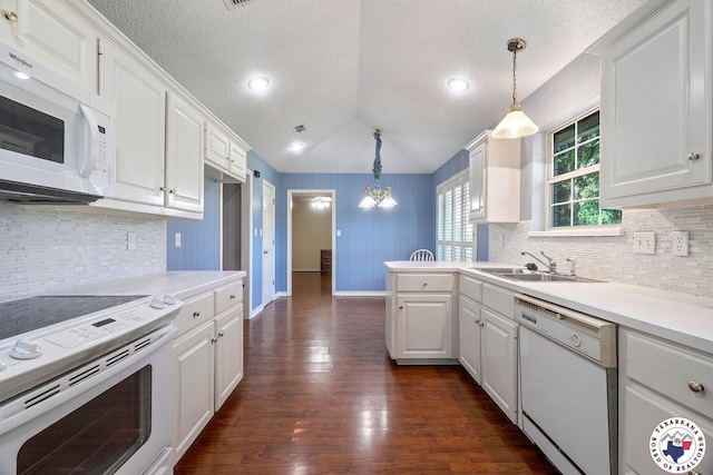 6102 Deerfield Dr, Texarkana, TX 75503 - kitchen featuring white appliances, a sink, white cabinets, a textured ceiling, and decorative backsplash