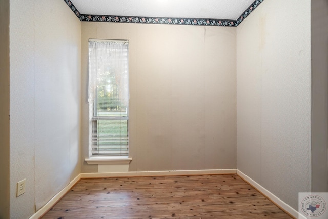 unfurnished room featuring hardwood / wood-style flooring