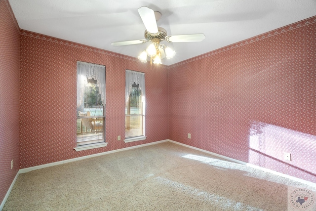 carpeted empty room with ceiling fan