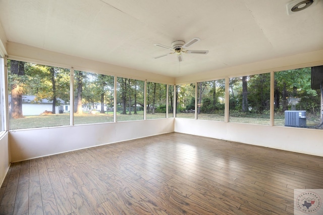 unfurnished sunroom with ceiling fan