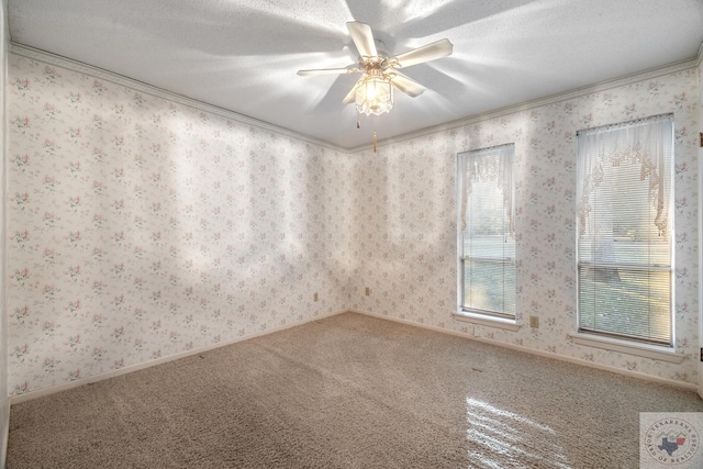 carpeted empty room with a textured ceiling, ceiling fan, and ornamental molding