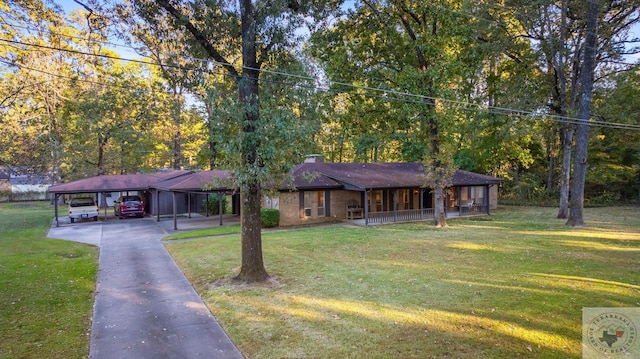 single story home featuring covered porch, a front lawn, and a carport