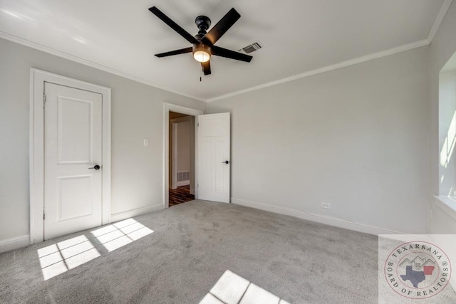 908 W Washington St, Clarksville, TX 75426 - unfurnished bedroom with ornamental molding, light carpet, and ceiling fan