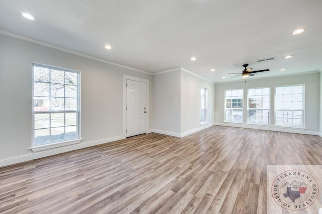 908 W Washington St, Clarksville, TX 75426 - unfurnished living room featuring ceiling fan, ornamental molding, and light hardwood / wood-style floors