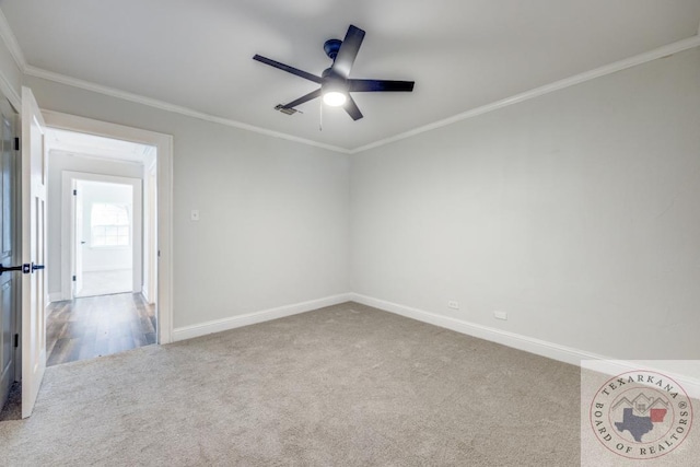 908 W Washington St, Clarksville, TX 75426 - empty room featuring carpet, crown molding, and ceiling fan