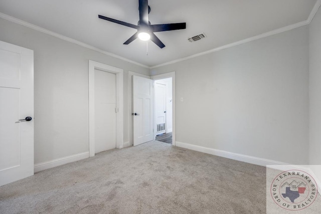 908 W Washington St, Clarksville, TX 75426 - unfurnished bedroom featuring light carpet, ceiling fan, and crown molding