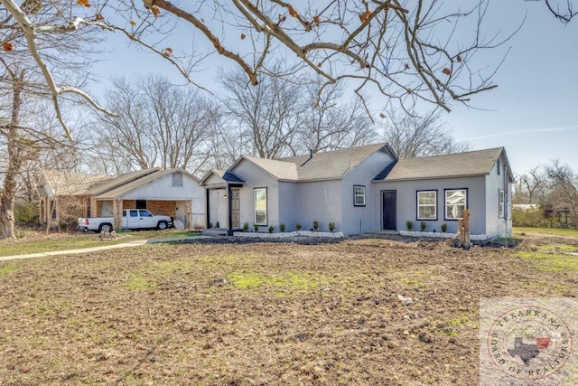 ranch-style house featuring a front lawn