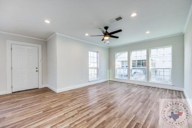 908 W Washington St, Clarksville, TX 75426 - unfurnished living room with ceiling fan, light hardwood / wood-style flooring, and crown molding
