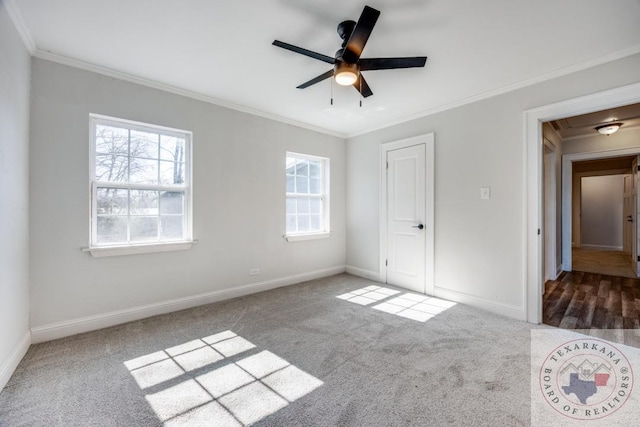 908 W Washington St, Clarksville, TX 75426 - unfurnished bedroom with ceiling fan, ornamental molding, and carpet