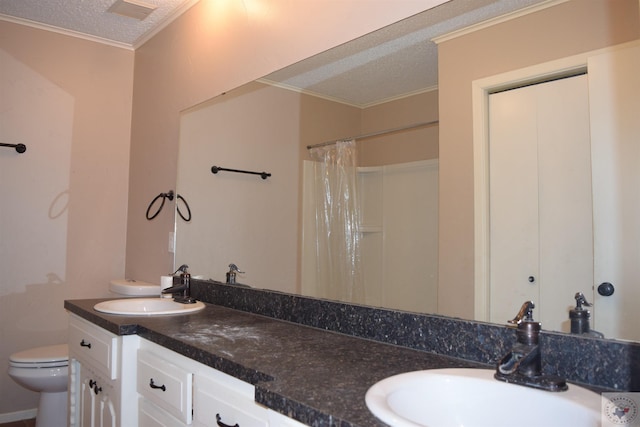 bathroom featuring a textured ceiling, vanity, a shower with curtain, toilet, and crown molding