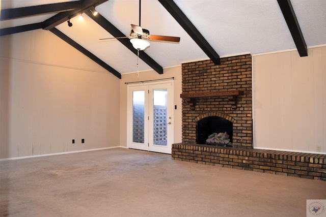 unfurnished living room with ceiling fan, carpet flooring, vaulted ceiling with beams, and a fireplace