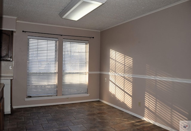 unfurnished dining area featuring crown molding and a textured ceiling