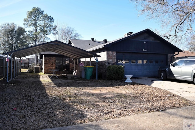 view of side of property featuring a garage, central air condition unit, and a carport