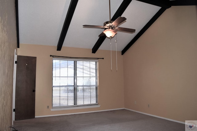 carpeted spare room with ceiling fan and vaulted ceiling with beams