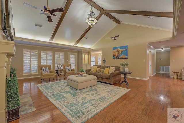 living room with high vaulted ceiling, beam ceiling, ceiling fan, and a healthy amount of sunlight