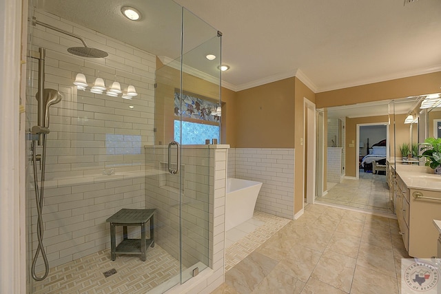 bathroom with ornamental molding, separate shower and tub, tile patterned flooring, and vanity